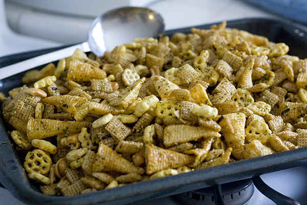 Mixing the chex mix to go into the oven