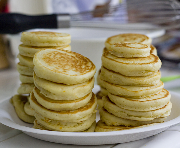 Stacks of mini orange mochi pancakes