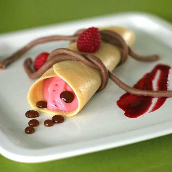 Crepes Filled with Raspberry Creme Fraiche, topped with Maple Pearls and tied shut with Chocolate Bucatini