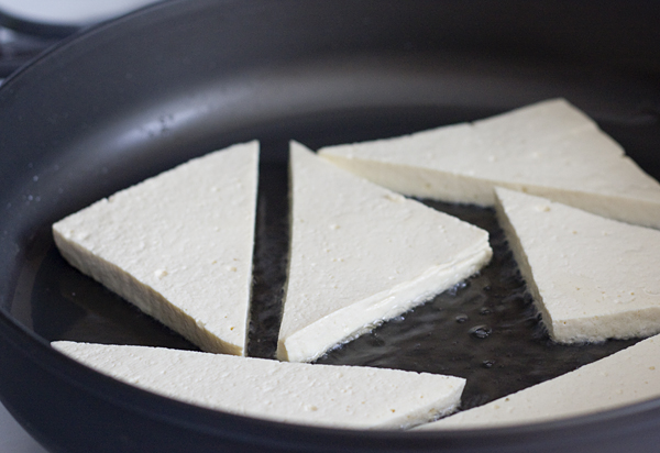 Frying the tofu triangles