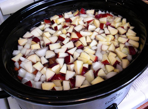 Split pea soup ingredients going into the slow cooker