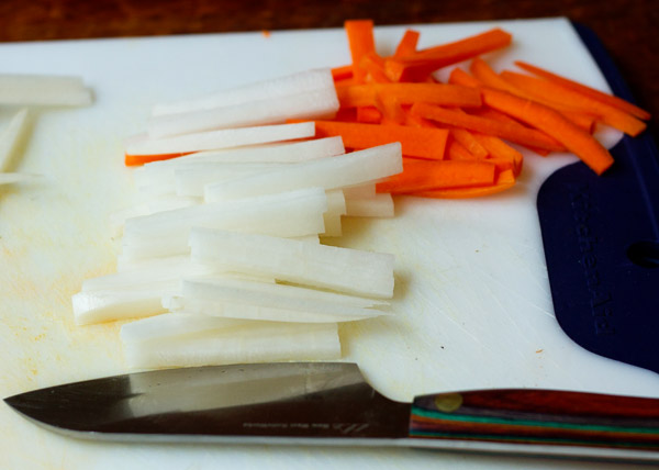 Cut carrot and daikon into thin planks