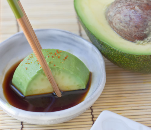 Dip the avocado in soy sauce