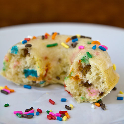 Eating confetti cake baked doughnuts