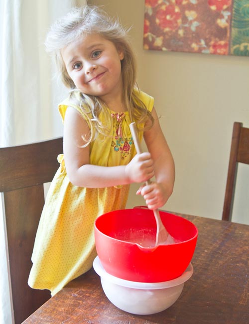 My sous chef stirring the custard