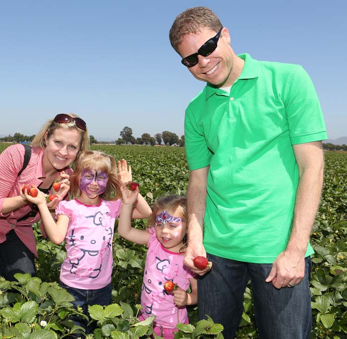 The Fuji family in a strawberry field