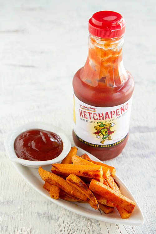 Eating sweet potato fries with Ketchapeno