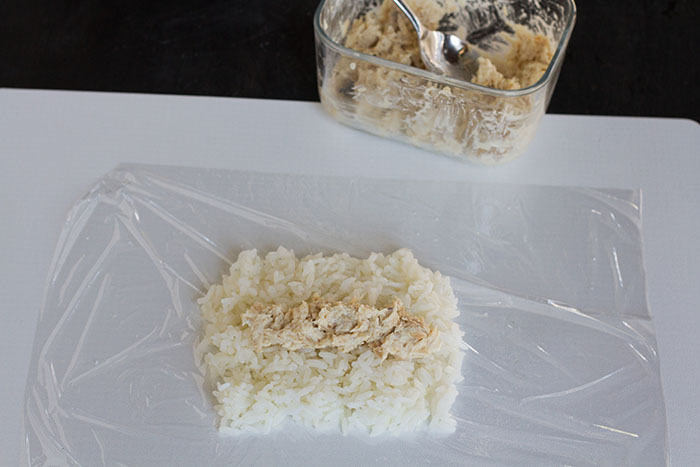 Adding filling to a stick onigiri