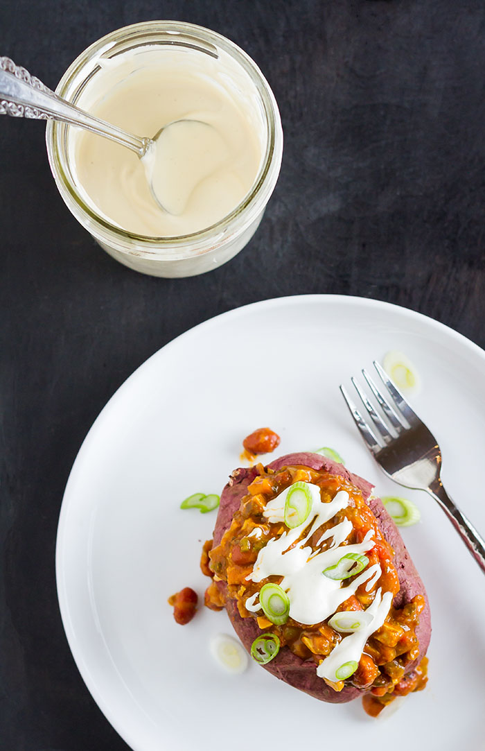 Baked potato topped with Vegan Fuji Slow Cooker Pumpkin Chili