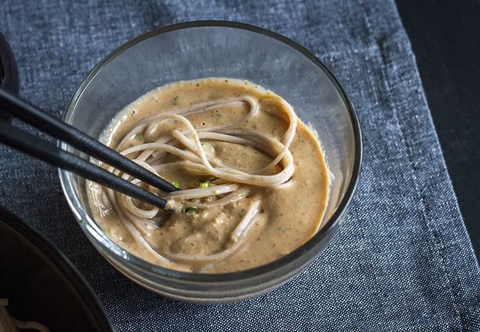 Dipping soba in the walnut sauce