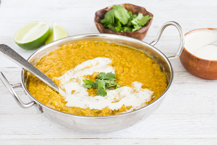 Instant Pot Red Lentil Dal drizzled with cashew cream