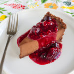 Chocolate Truffle Pie with Triple Berry Sauce