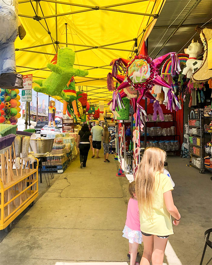 Checking out the pinatas in the Pinata District