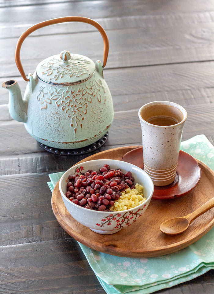 Bowl of Japanese sweet red bean soup with a japanese tea kettle
